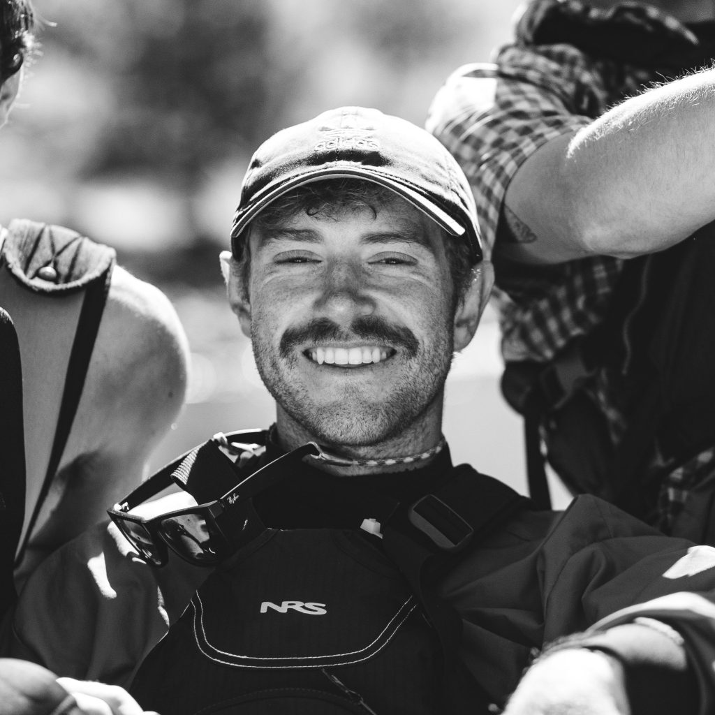 Man with hat in group photo