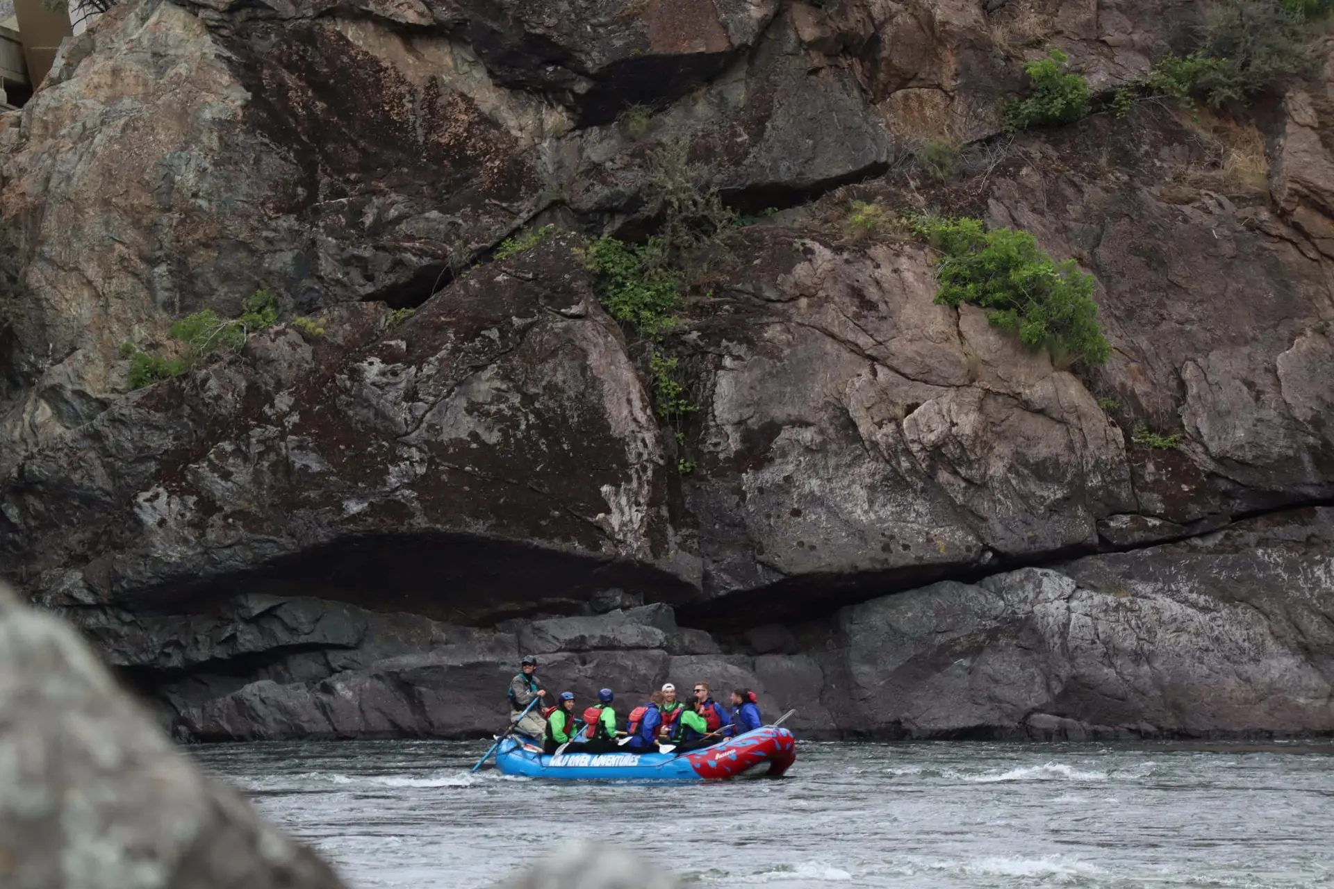 group of people on a raft on a river